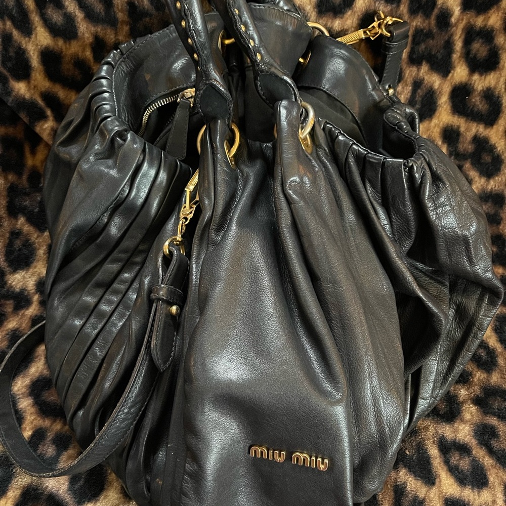 H 12in L 18in W 10in Gently used bag.